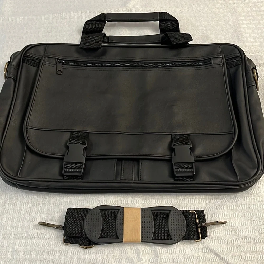 Briefcase, Black, Handles and Shoulder Straps lots of storage.